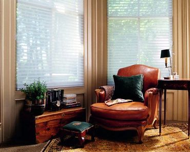 White blinds over two windows