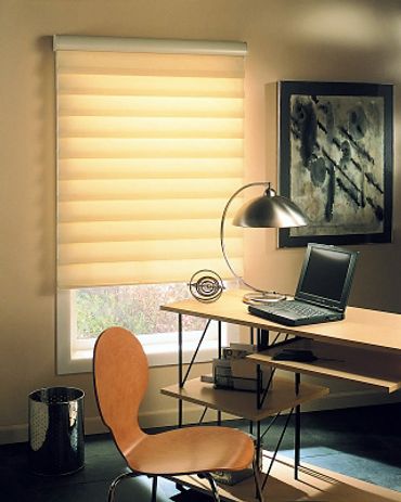 A white shade over a window