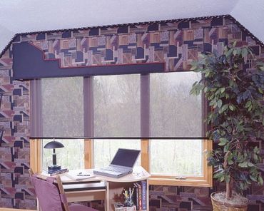 Gray shades over three windows