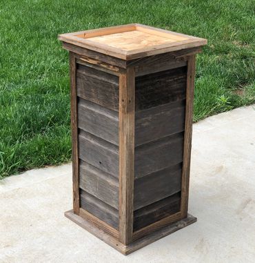 Rustic barnwood siding pedestal with a square top, handcrafted for deer or elk shoulder mounts.