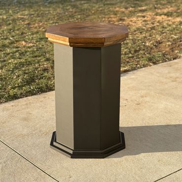 Black modern octagon pedestal with a finished oak top for competition pedestal mounts
