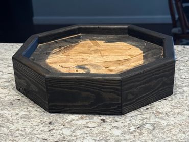 Small octagon base built of pine and stained black, Built by Nichols Taxidermy Bases