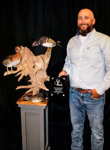 Custom gray square pedestal with wood duck scenery on top, built by Nichols Taxidermy Bases