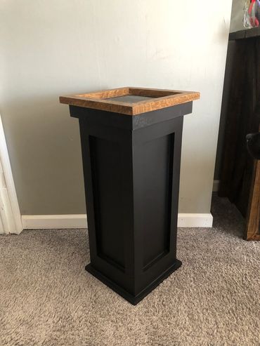 Black square pedestal with hardwood top, built for game mounts. Built by Nichols Taxidermy Bases