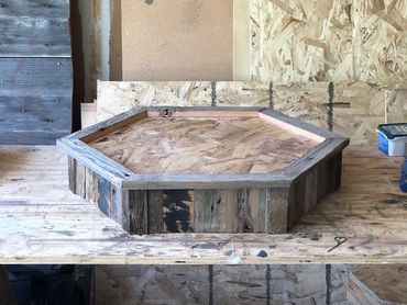 Short hexagon barn wood base platform for small game or bird display.