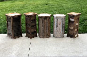 Rustic barnwood taxidermy pedestals in various styles for deer and game mounts.