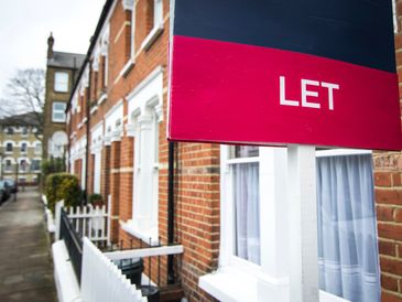 'To Let' estate agent sign on residential street