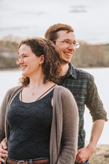 A romantic portrait of a couple sharing an intimate moment in the evening sun on the beach