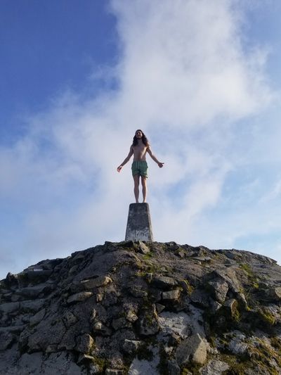 Kyle standing tall and grounded with great posture on the summit of Ben Nevis.