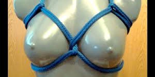female mannequin in a blue rope breast bondage