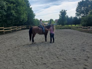 One of the Equestrian Facility students getting a lesson she will be trail riding before we know it.