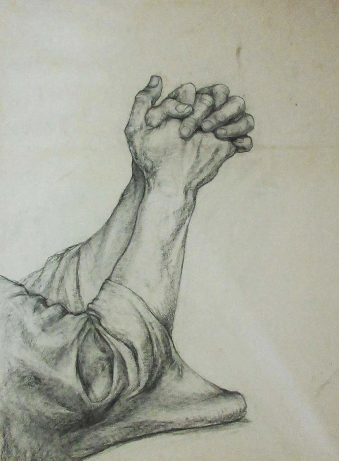 Charcoal study of praying hands.