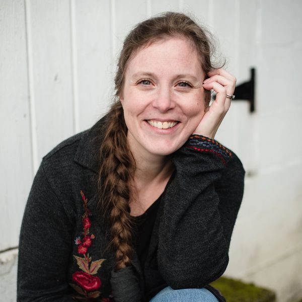 Photo of Marissa Burt, podcast host & author, sitting outdoors.