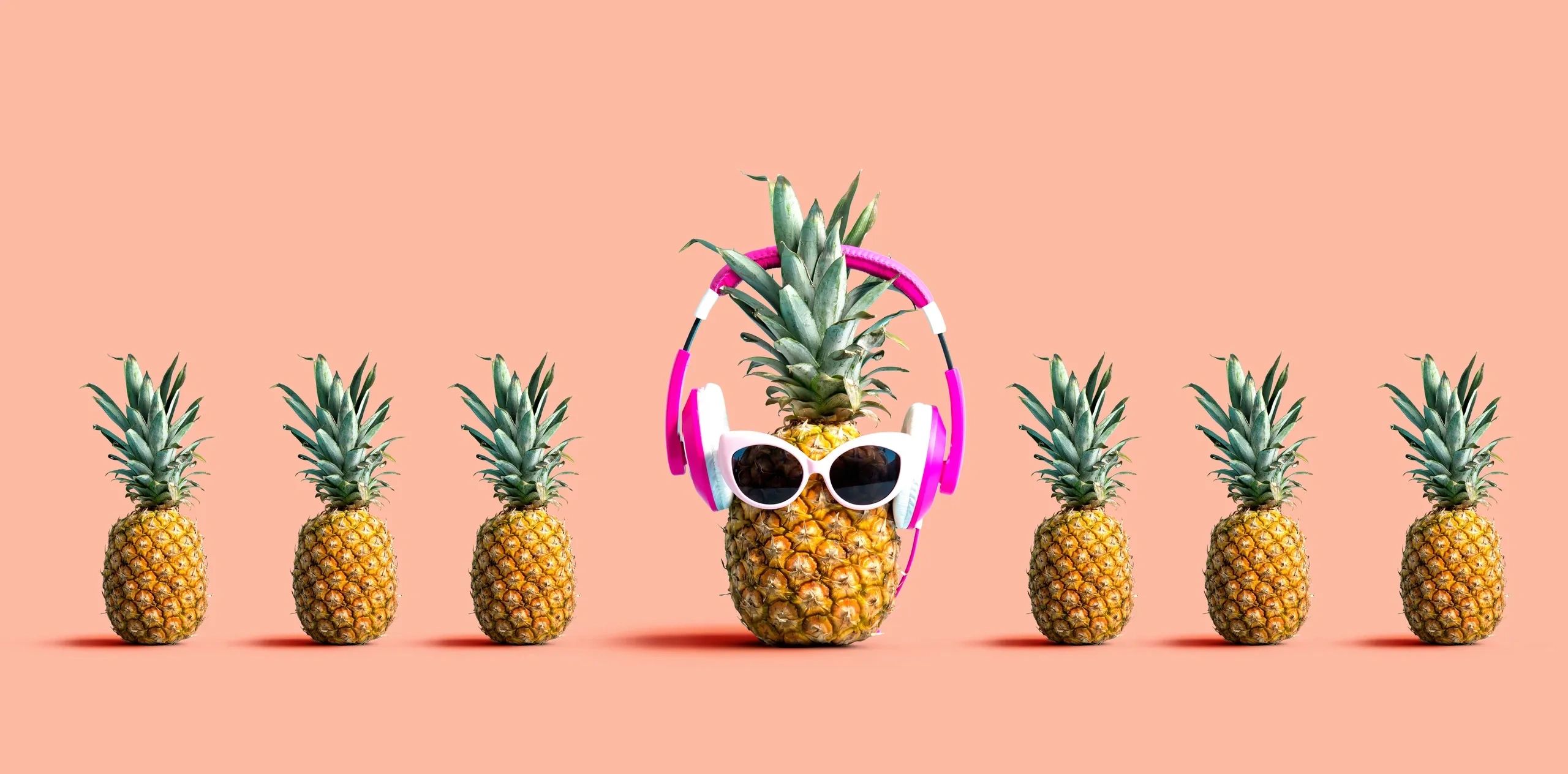 Three adults focused on drawing portraits on easels in an art class.