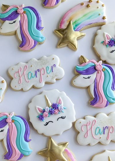 Unicorn sugar cookies with a shooting star, unicorn face, unicorn head, and name plaque cookie