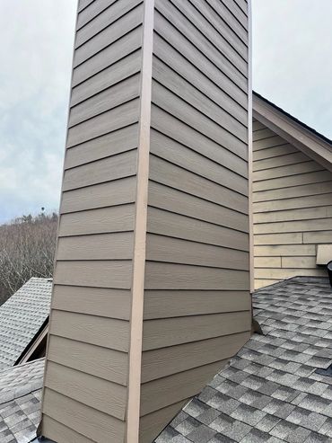 New lap siding on a rebuilt chimney chase, Jasper's Handyman exterior repair