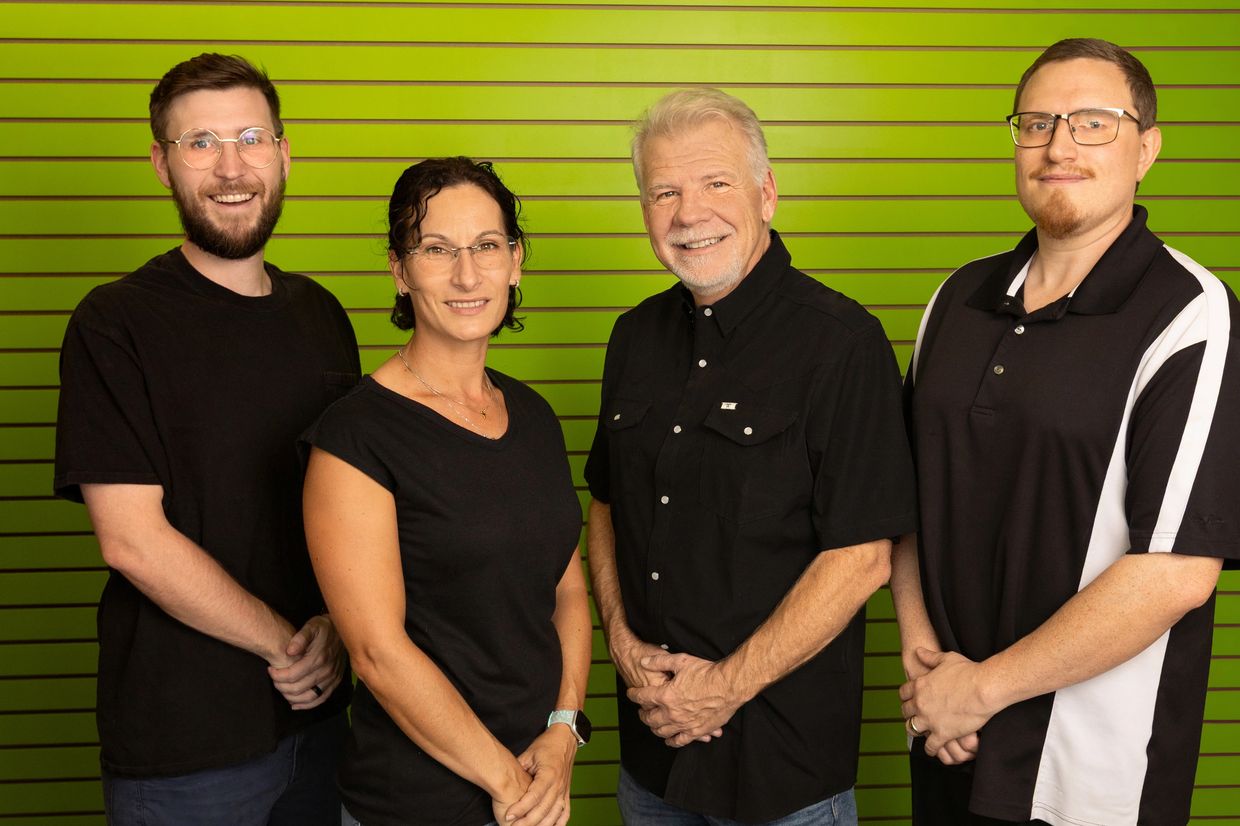 The Computer Loft team, smiling in the lobby of the store located next to H-E-B in La Vernia.