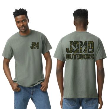 Man wearing a green t-shirt with camo text logos on front and back.