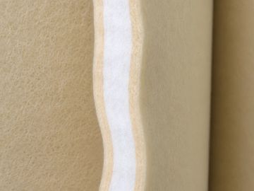 Close-up of a beige and white textured layered material.