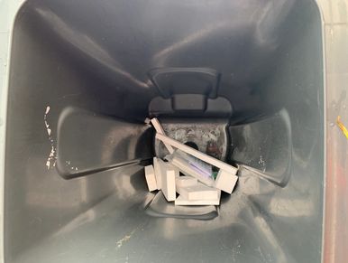 rubbish left in the bottom of a wheelie bin