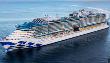 A large modern cruise ship sailing on the ocean.