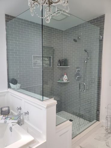 New glass tile with bench with new enclosure. Jacuzzi tub ,marble floors