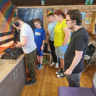 This is a picture from our music class The adults learning the basics to mixing music.