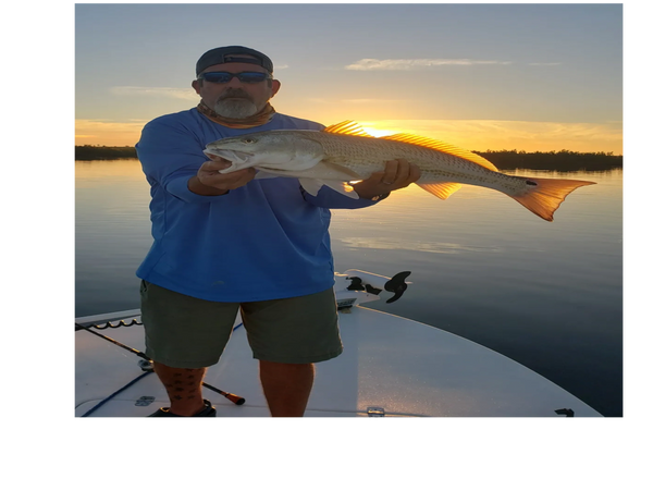 client with redfish caught on a inshore fishing trip