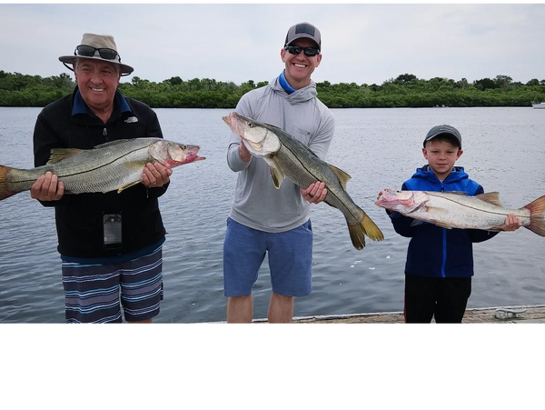 clients with snook they caught inshore fishing