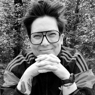 The company founder, brand strategist, designer and art director Jade Amic smiling at the camera