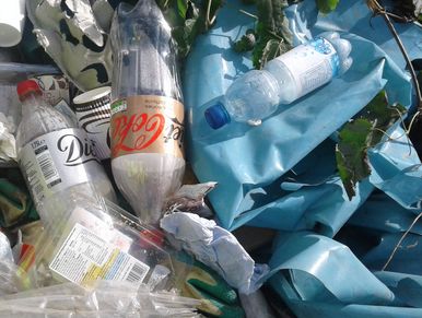 close up of mixed recycling, called DMR in Redhill in a pile of rubbish.
