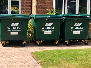 Wilrose commercial waste wheelie bins 1100L bins outside a school.