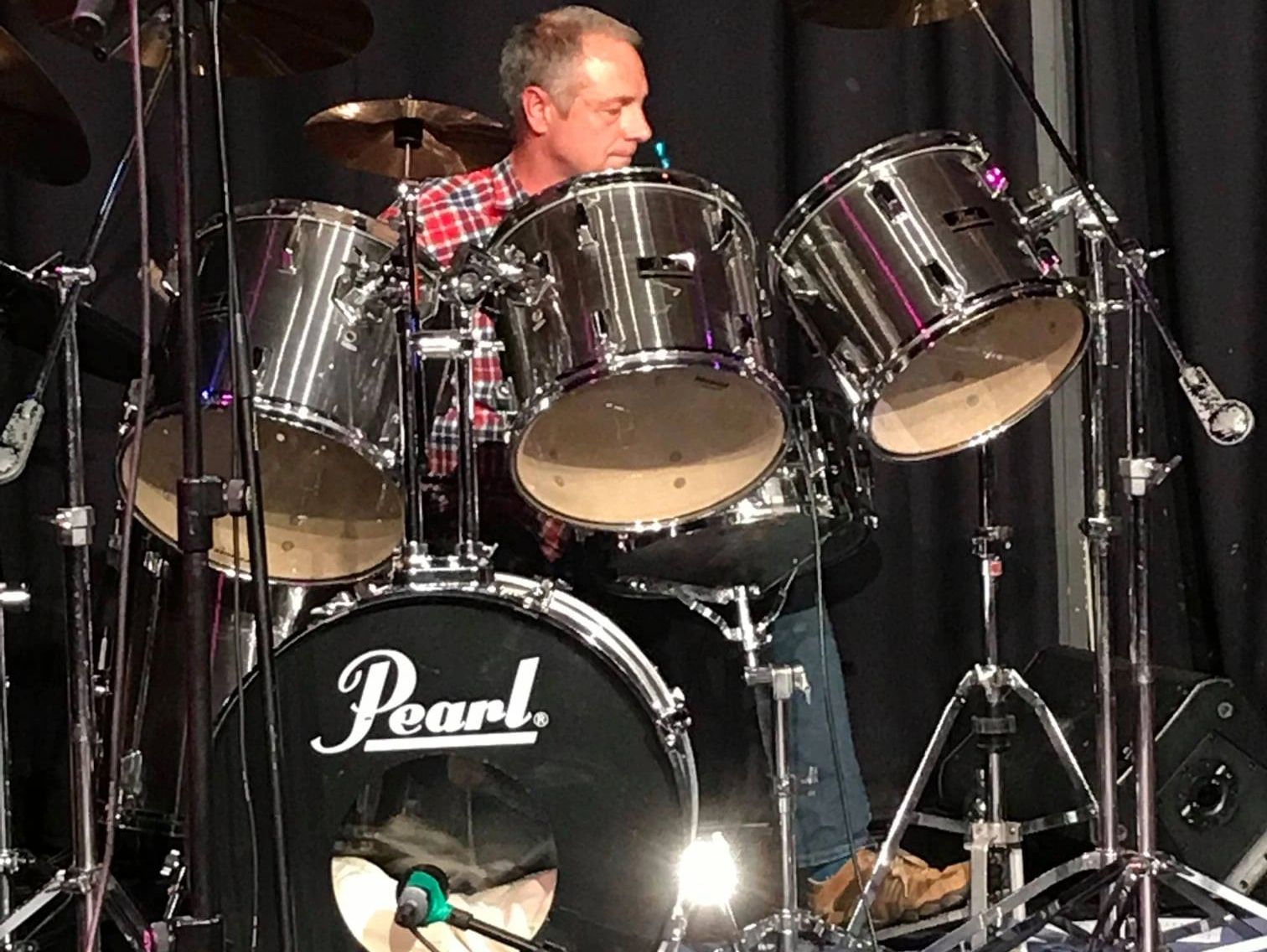 The drummer plays the drums