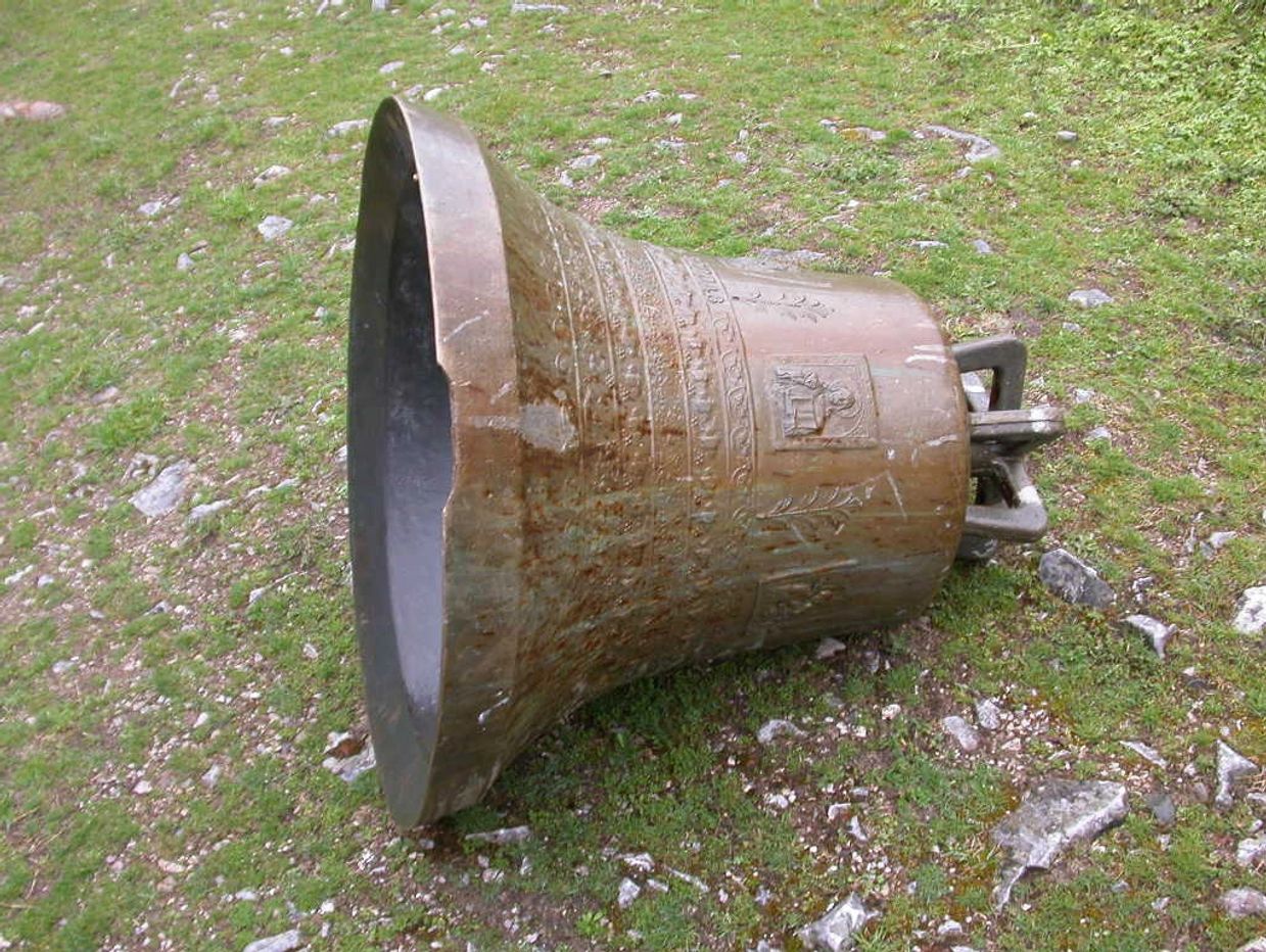 image of an orthodox church bell that has been ripped off from a church and desecrated and broken