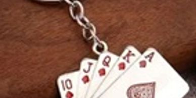 Keychain with playing cards design.