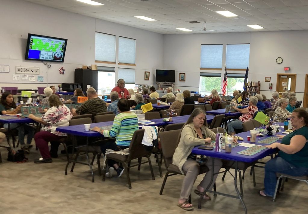 People sitting at tables playing Bingo