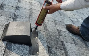 Roof sealant placed on top of exposed nails for vents or flashing.