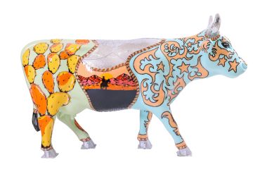 Colorful painted cow sculpture with desert and floral patterns.