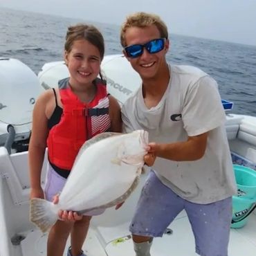 Children's fishing trip, Fluke fishing in Rhode Island. Family Fishing Charter