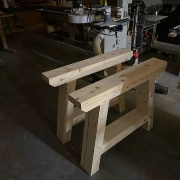 Circular sawn 4x6 from a church bell tower are transformed into table legs.