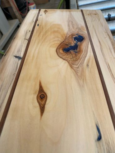 Walnut strips add to the aesthetic of this piece.