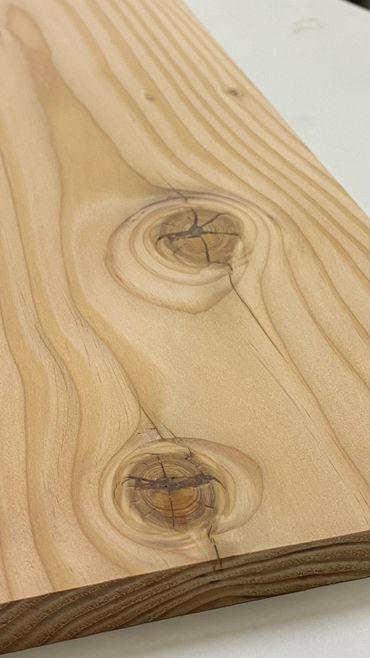 Big knot in douglas fir filled with ca glue to stabilize.