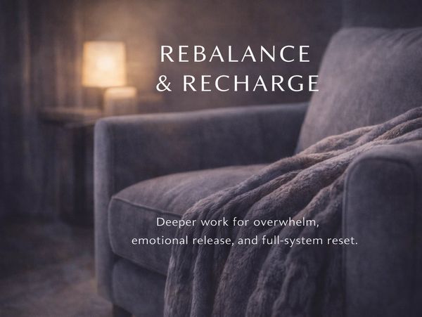 Rebalance + Recharge reflexology service image for Zen Reflexology at The Zen Within in Newport Pagnell, showing a soft chair, blanket and warm calming light.