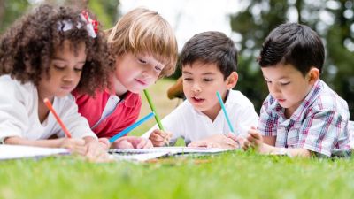 kids learning and drawing outside