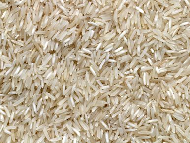 Close-up of uncooked long-grain rice kernels.