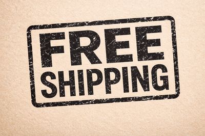 A stamp with the text 'FREE SHIPPING' on a textured background.