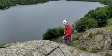 climber learning the ropework of rock climbing