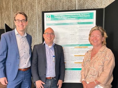 In front of poster - Ronald Pennings, Erwin van Wijk and Carol Brill, author and co-authors.