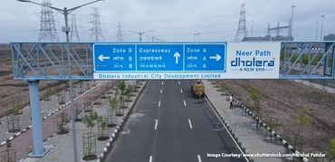 Road sign indicating directions to Zone A, Zone B, and the Expressway in Dholera Industrial City.