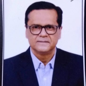 Professional portrait of a man in glasses and a suit jacket.